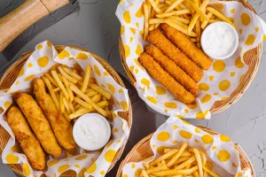 AnyConv.com__assorted-fast-food-platters-on-gray-tabletop-2024-05-22-17-47-15-utc